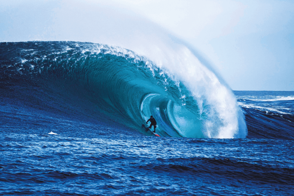 Surfer surfing on a sea tide.