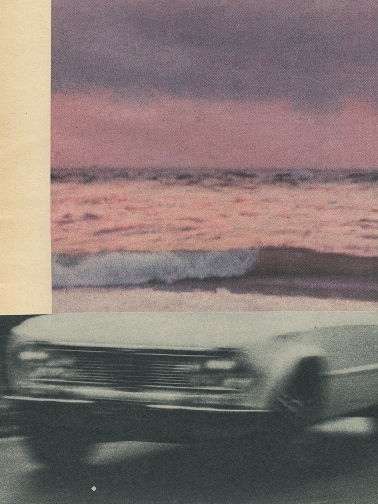Image of a car driving by sea.