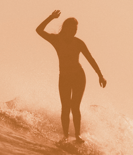 Image of a person's shadow who's surfing.