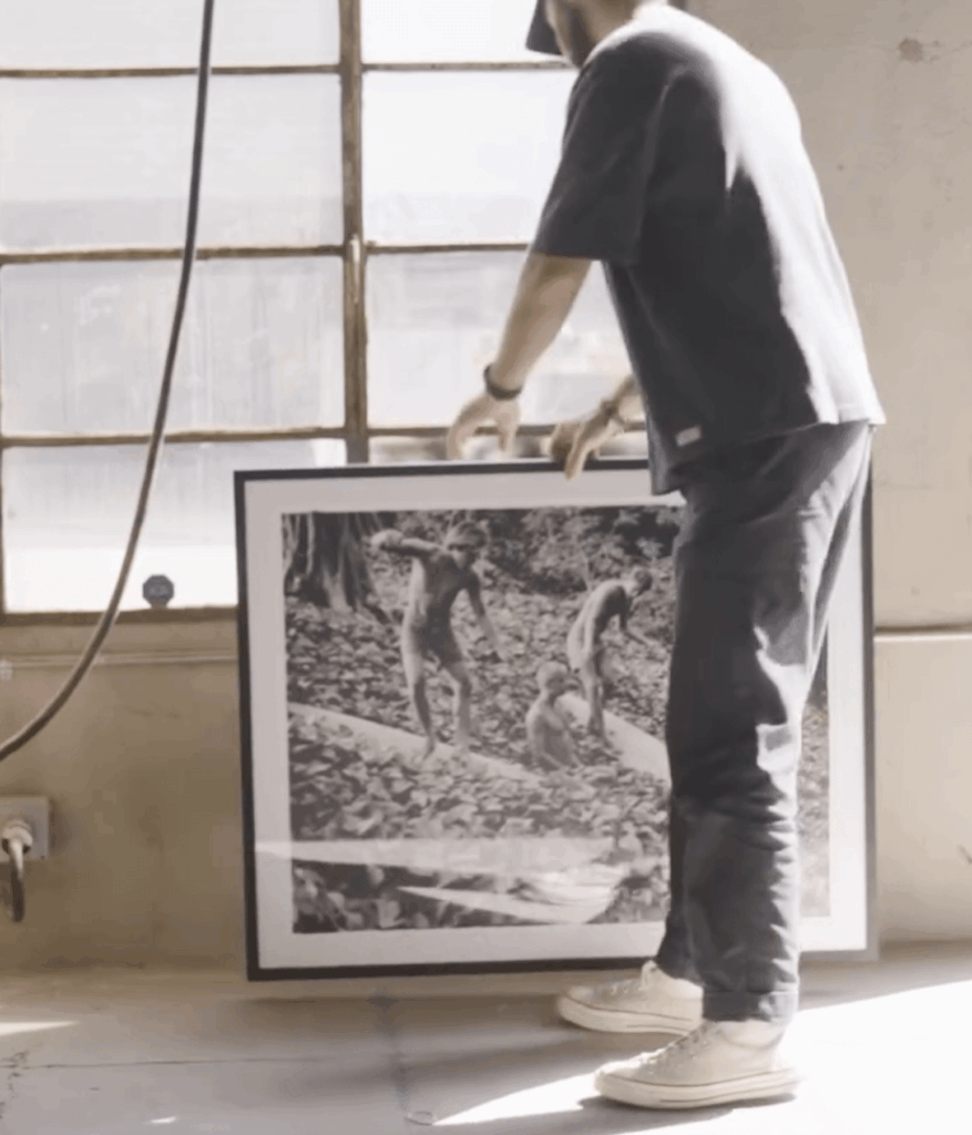 Person putting down an image.